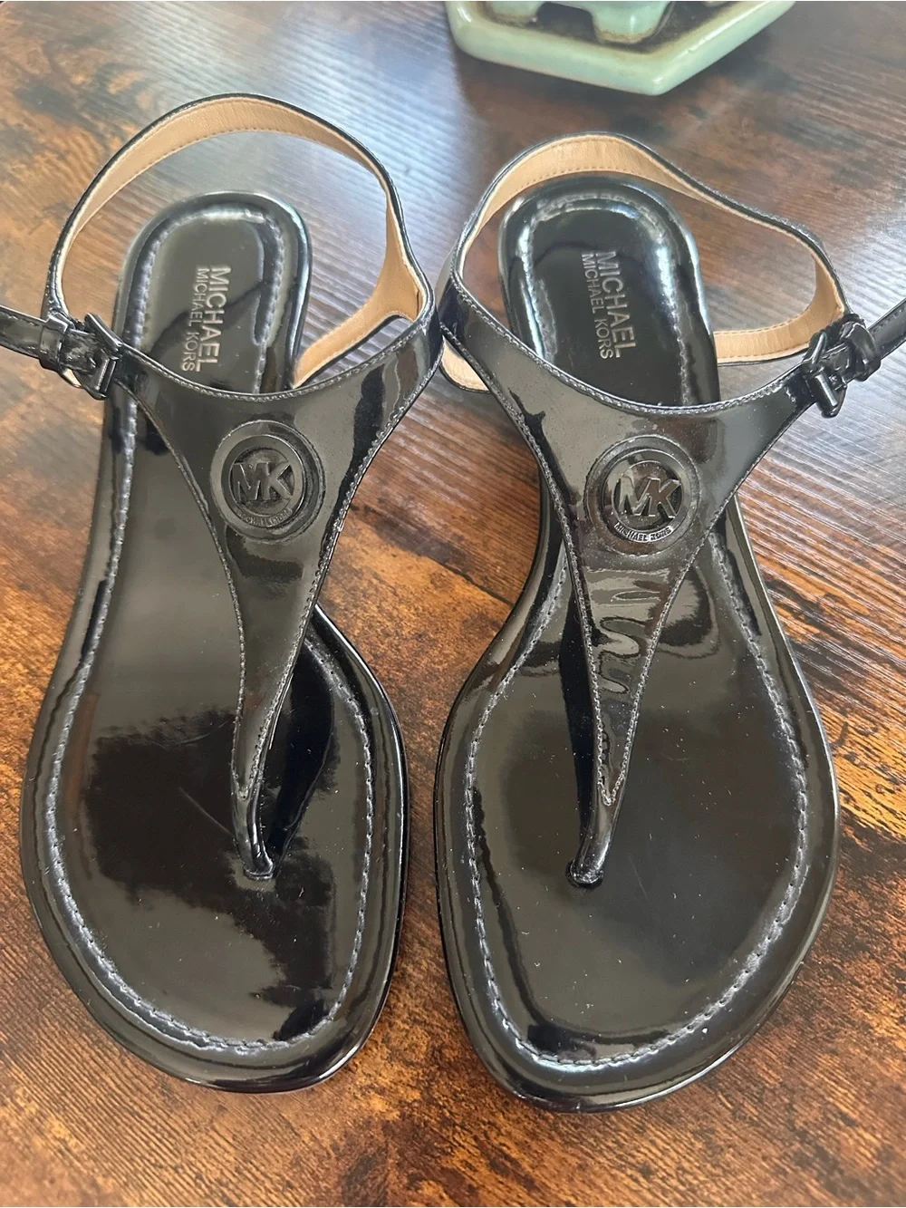 Michael Kors Black Patent T-Strap Sandals with Logo Medallion